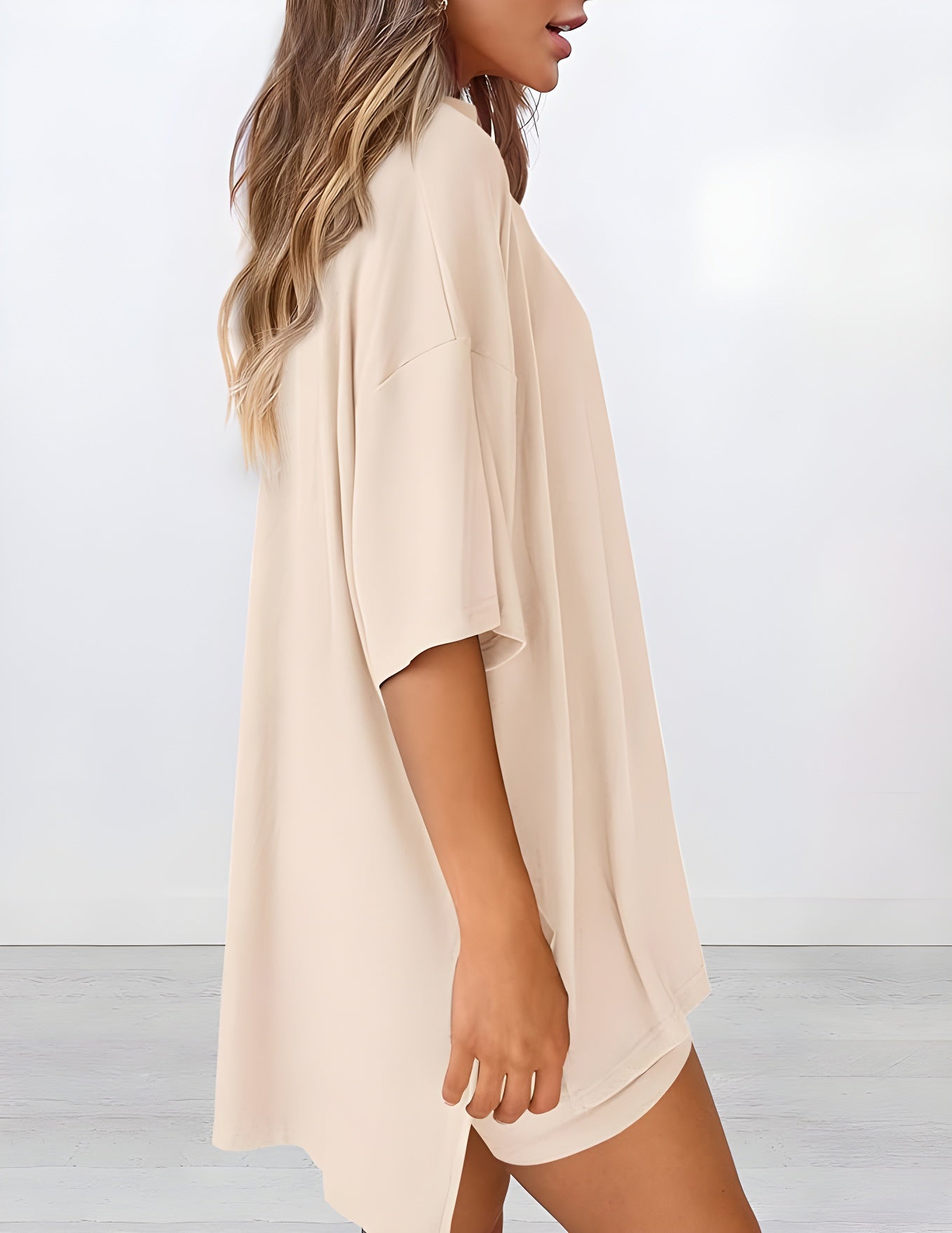  Side view of women’s summer loungewear set in beige – oversized relaxed fit two piece with t-shirt and shorts