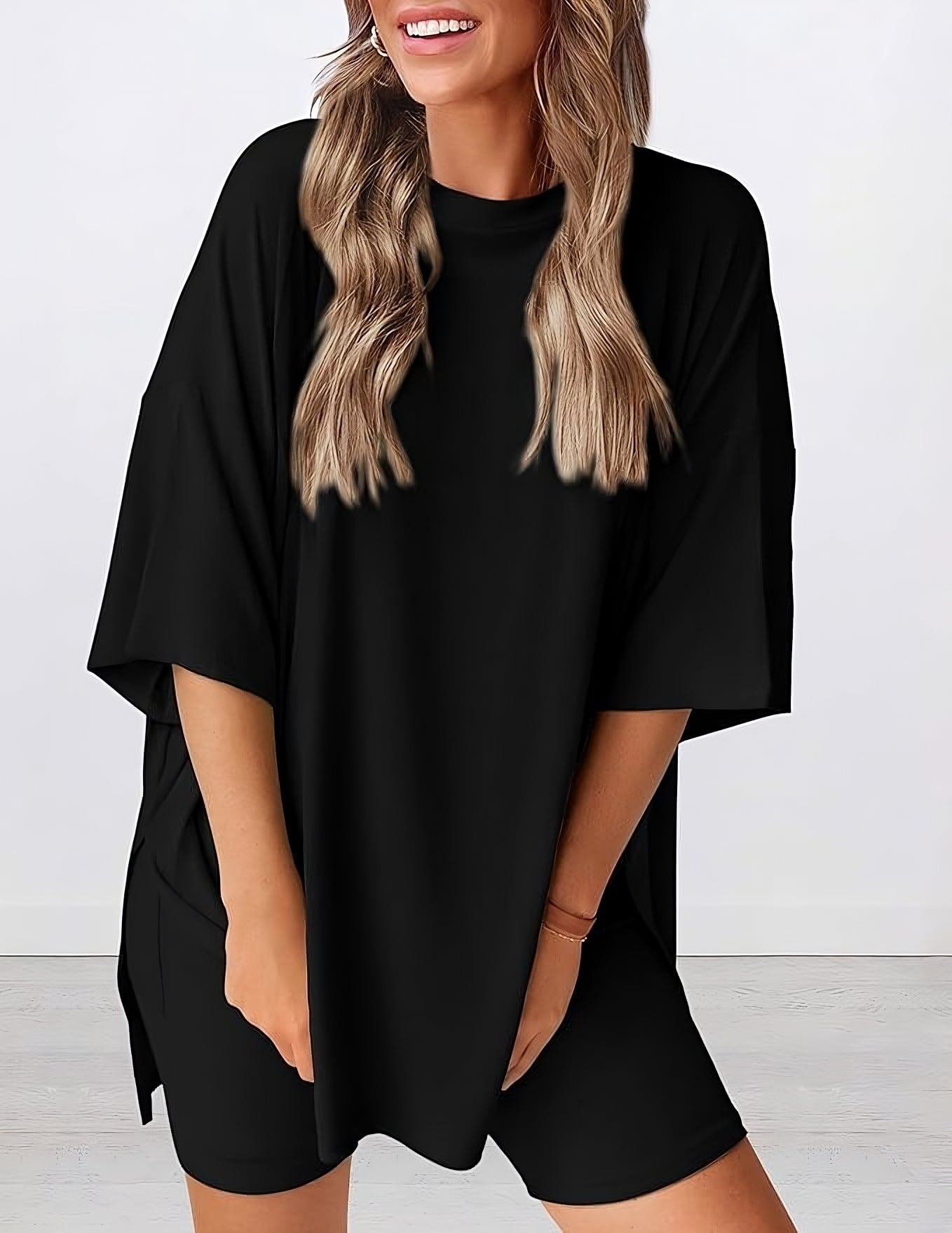 Angled view of lightweight two piece lounge set in black – breathable oversized t-shirt and shorts for women