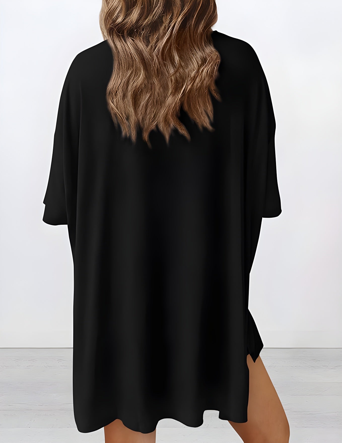 Back view of buttery soft loungewear set in black – oversized top and shorts for casual comfort