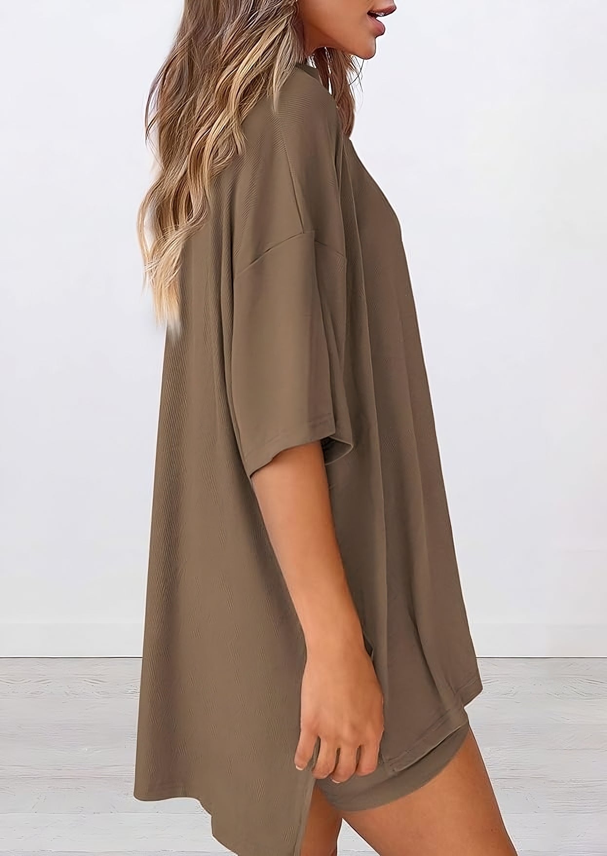 Side view of women’s summer loungewear set in dark khaki – oversized relaxed fit two piece with t-shirt and shorts