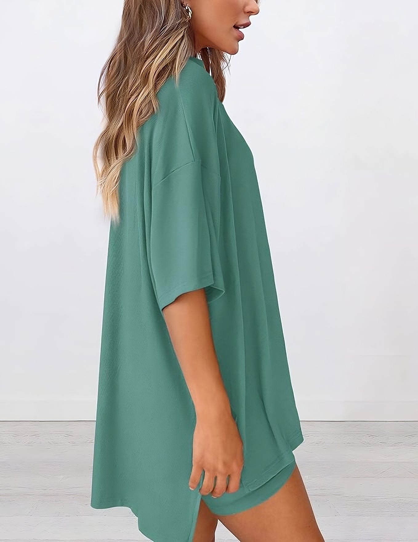 Side view of women’s summer loungewear set in fruit green – oversized relaxed fit two piece with t-shirt and shorts