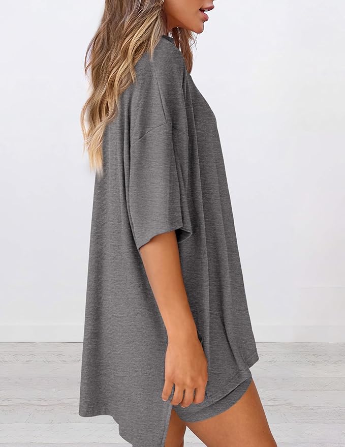 Side view of women’s summer loungewear set in gray – oversized relaxed fit two piece with t-shirt and shorts