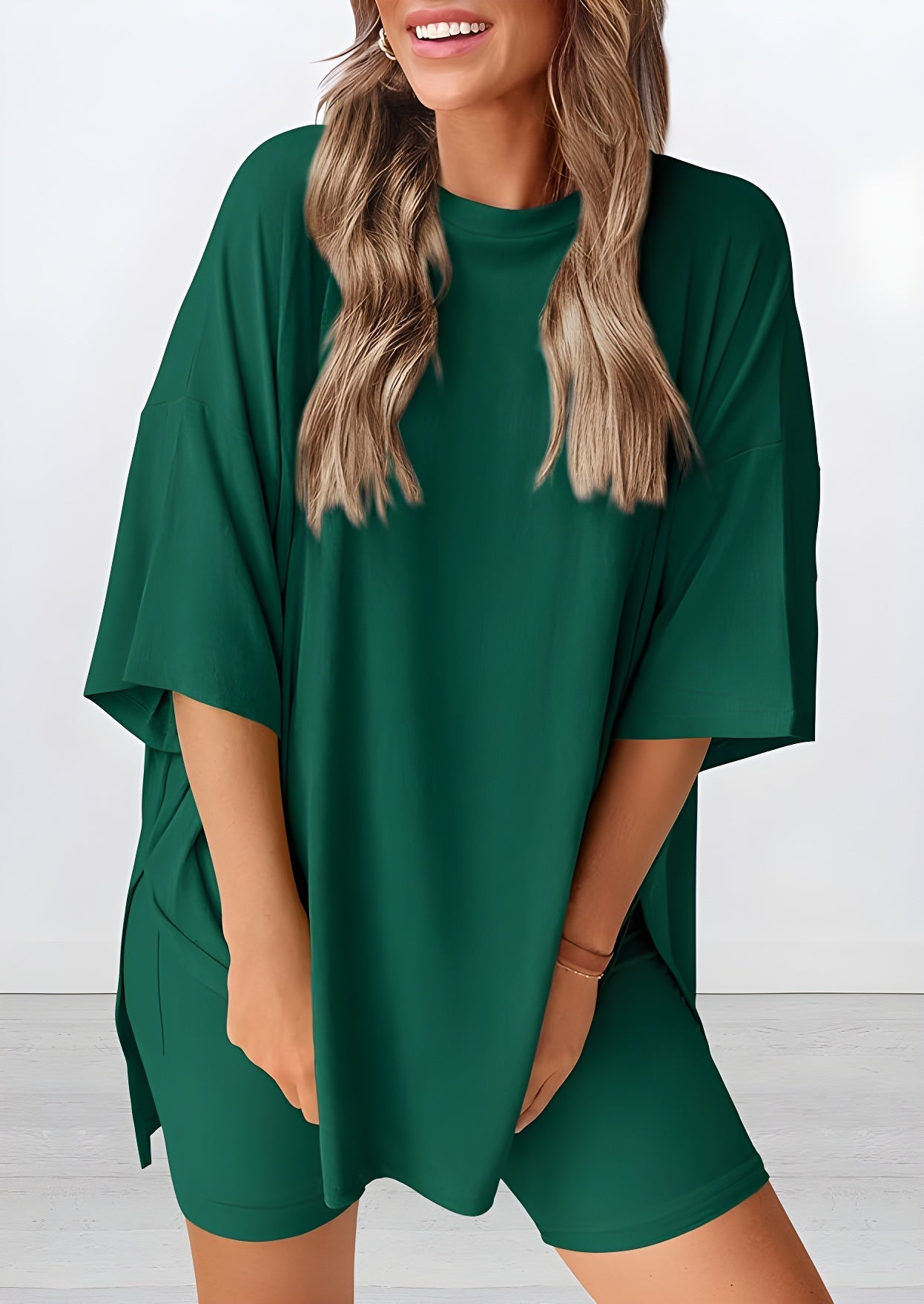Angled view of lightweight two piece lounge set in green – breathable oversized t-shirt and shorts for women