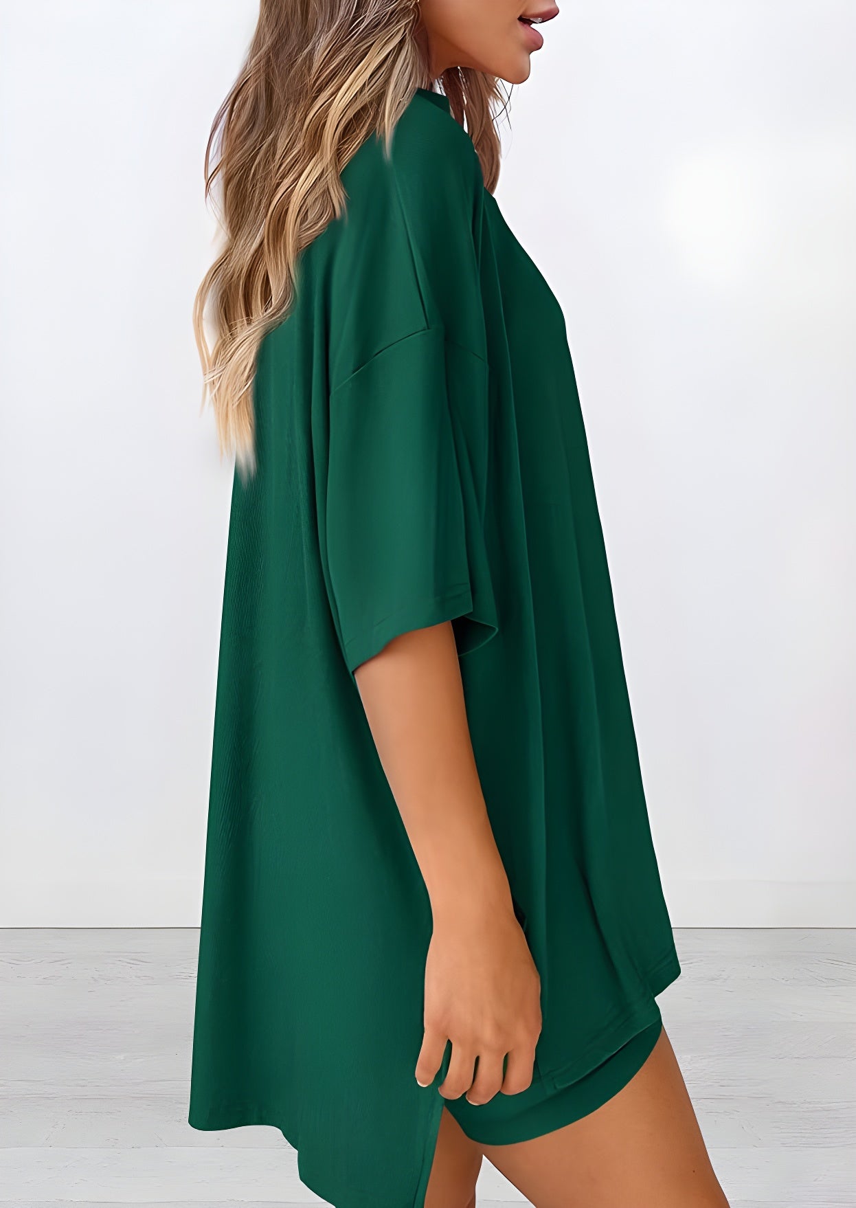 Side view of women’s summer loungewear set in green – oversized relaxed fit two piece with t-shirt and shorts