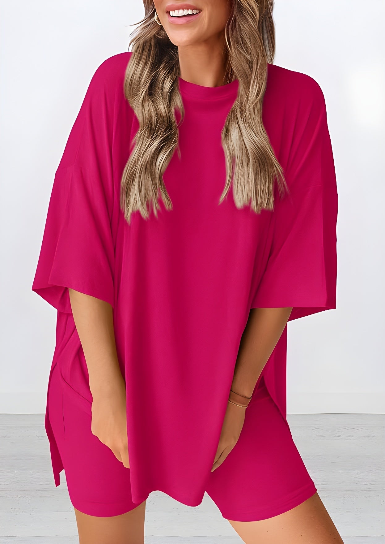 Angled view of lightweight two piece lounge set in rose red – breathable oversized t-shirt and shorts for women