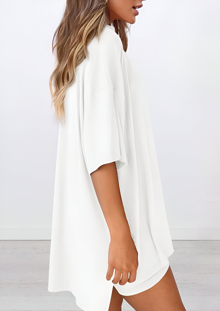 Side view of women’s summer loungewear set in white – oversized relaxed fit two piece with t-shirt and shorts
