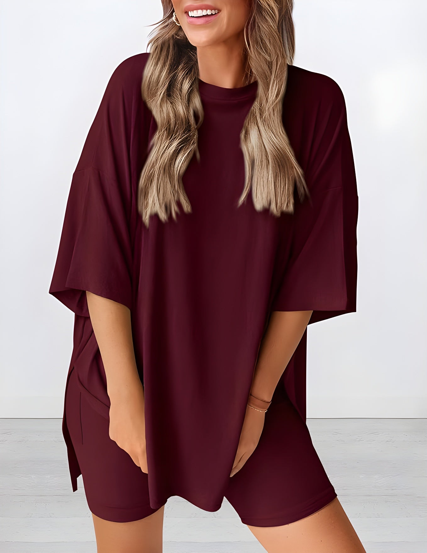 Angled view of lightweight two piece lounge set in wine red – breathable oversized t-shirt and shorts for women
