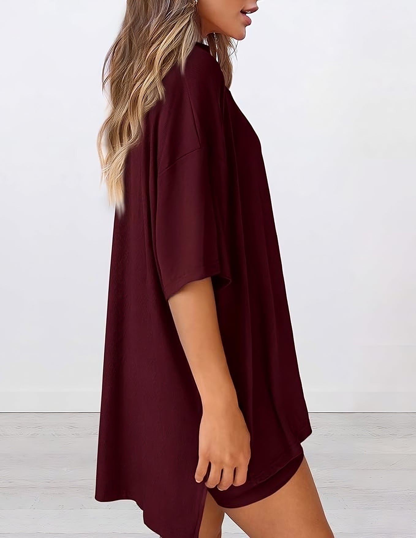  Side view of women’s summer loungewear set in wine red – oversized relaxed fit two piece with t-shirt and shorts